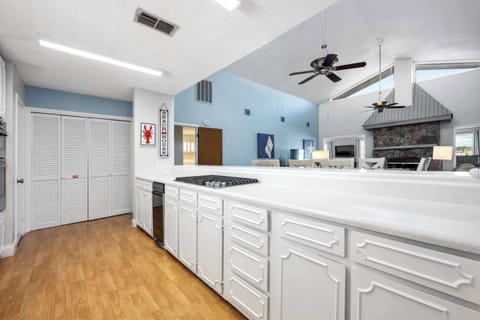 The upper-level’s airy kitchen offers ample space & all the comforts of home