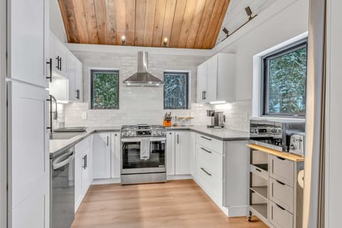 Kitchen: Keurig, kettle, toaster, cooking utensils, tableware