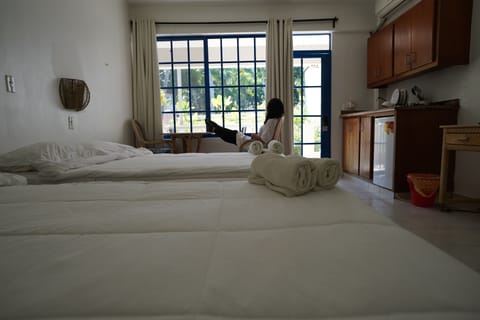 Quadruple Room, Balcony, Pool View | 1 bedroom, in-room safe, laptop workspace, blackout drapes