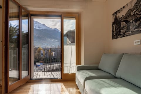 Apartment (1 Bedroom) | Living area | 55-inch TV with satellite channels