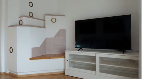 Apartment (1 Bedroom) | Living area | 55-inch TV with satellite channels