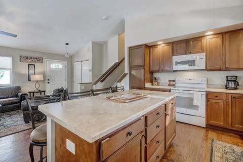 Cook and connect in this open-concept kitchen with plenty of counter space, modern appliances, and a seamless flow into the living and dining areas!