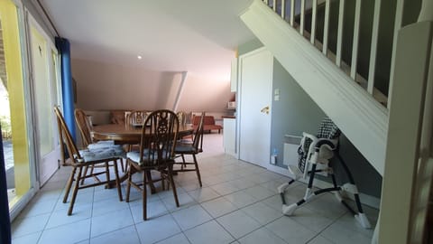 Dining area, stairs to bedrooms. 