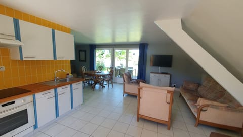 Kitchen, dining and seating areas.