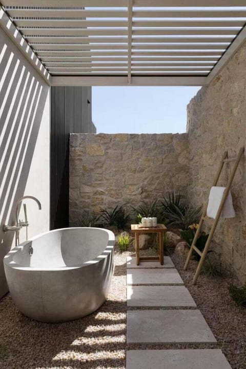 Enjoy the relaxing outdoor spa with a soaking tub, perfect for star gazing.