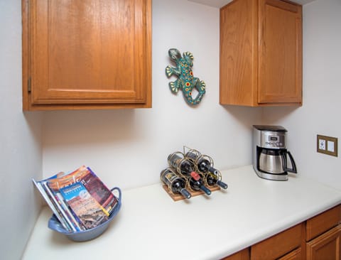 The coffee nook includes a drip coffee maker & coffee supplies