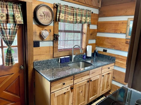 Kitchen sink overlooks the back porch with a view