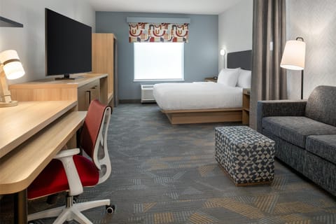 Desk, laptop workspace, blackout drapes, iron/ironing board