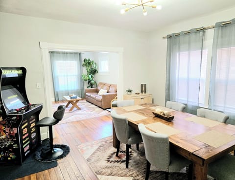 Large, custom dining table and arcade for game night with family or friends