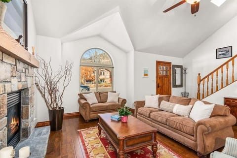 Spacious living room with cathedral ceilings and gas fireplace