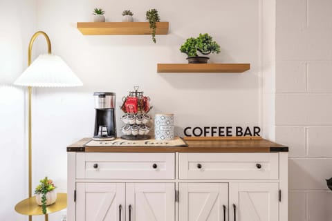 Start your day at the convenient coffee bar, stocked with all you need for the perfect brew. With a selection of coffee, tea, and all the essentials, this cozy nook is ideal for crafting your morning pick-me-up or an afternoon refreshment. Whether you prefer a strong espresso or a soothing tea, the coffee bar offers a personal touch to elevate your stay.