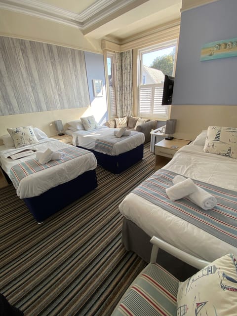 Family Triple Room | Premium bedding, iron/ironing board, free WiFi, bed sheets