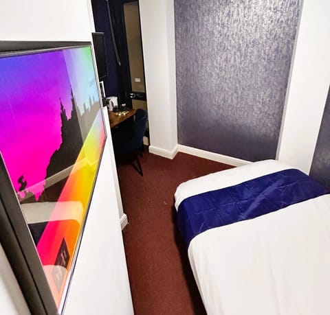 Economy Double Room | Desk, laptop workspace, blackout drapes, iron/ironing board