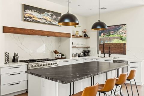 Stylish countertops and open layout make this the heart of your desert stay.