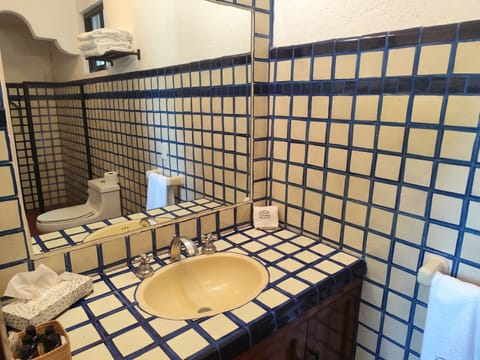 Superior Suite, 1 King Bed | Bathroom | Shower, hair dryer, towels, soap