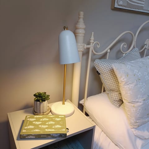 Lovely bedroom with double bed and bedside lockers with lamps. 