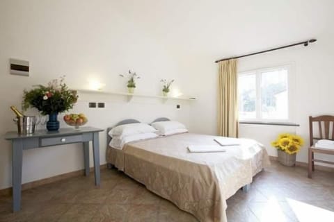 Classic Quadruple Room, Garden View | In-room safe, desk, blackout drapes, free cribs/infant beds