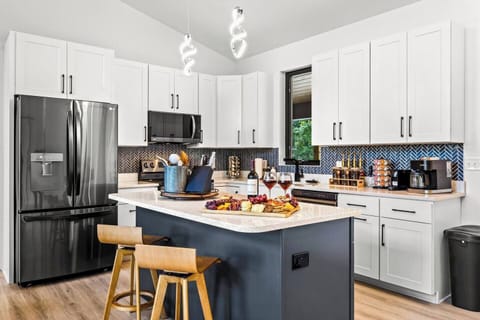 Cook up a storm in the sleek and modern kitchen, equipped with top-of-the-line appliances and plenty of counter space.