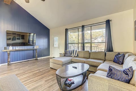 Bright living area with sectional sofa, and Smart TV