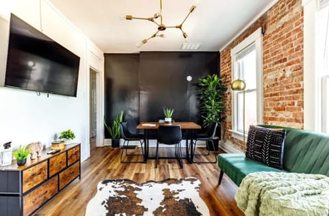 light-filled dining area with comfy seating & jungle decor for the ultimate vibe