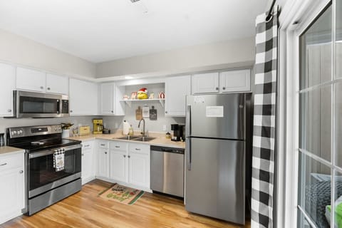 The kitchen includes stainless steel appliances, silverware, cookware, dishware and more.
