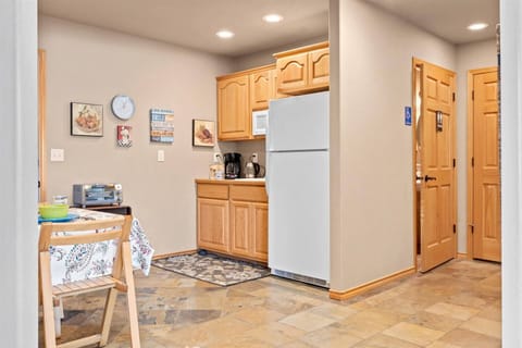 Open kitchenette area featuring toaster oven and other small appliances!