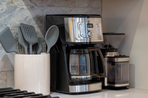 - Wake up to fresh coffee with this sleek programmable drip machine and grinder combo - Utensil holder and marble backsplash complete the upscale morning station - Conveniently placed near the stove for easy access during breakfast prep