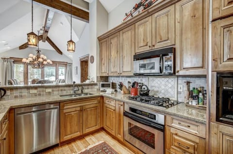 Cook like a chef in our gourmet kitchen, complete with high-end appliances, granite countertops, and ample storage space. Ideal for preparing delicious meals.