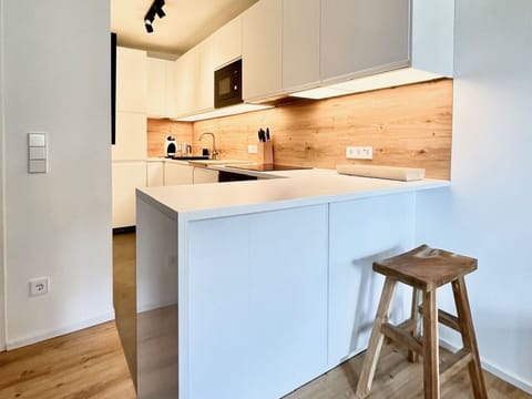 Countertop, Furniture, Interior Design, Kitchen, Flooring, Cabinetry, Floor, Wall, Wood, Kitchen Appliance