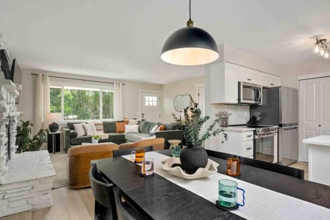 The open space kitchen, living room, and dining room allow for excellent flow while preparing and enjoying dinner.
