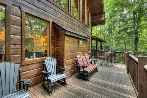 Enjoy nature from stylish rocking chairs on your private deck—perfect for sunset sips!