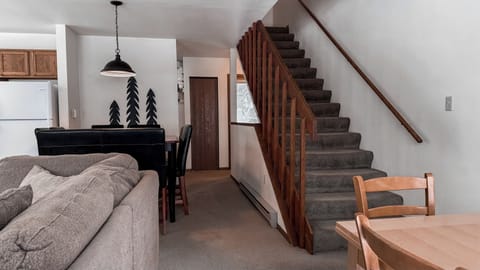 Main level living area with living room, kitchen, and dining area