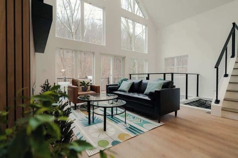 Living Room: Sunlit haven with panoramic views, stylish decor, and inviting seating for relaxation!