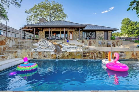 Large lower pool with slide and waterfall