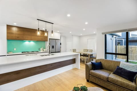 Plenty of natural light streams into the open plan living area with ranch sliders that open for indoor and outdoor flow.