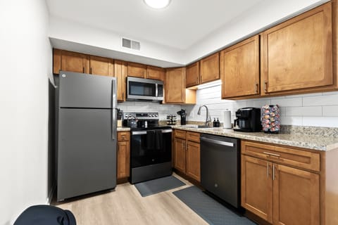 This modern kitchen comes fully stocked with a knife set, spice rack, and all the essential cooking tools.