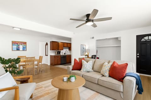Bright and welcoming living room with oversized window, perfect for relaxing or catching up on your favorite shows.