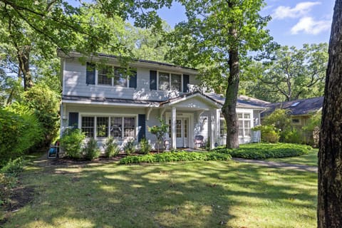 A charming first impression—lush green lawn and inviting entry.