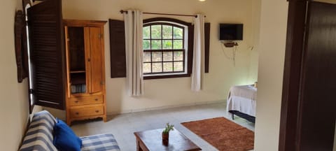 Basic Apartment | Living area | 32-inch flat-screen TV with satellite channels