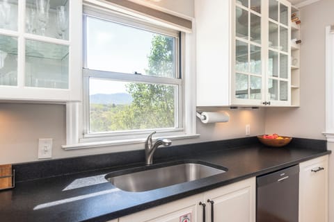 Wash dishes with views of the Blue Ridge Mountains.
