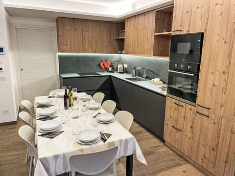 Kitchen, Countertop, Flooring, Wood, Furniture, Interior Design, Kitchen Appliance, Cabinetry, Major Appliance, Floor