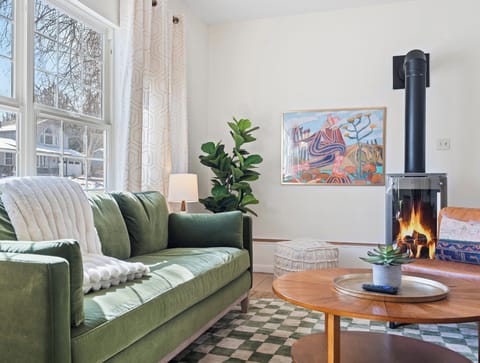 Super Cozy living area with comfy sofa, armchairs, bench, and gas fireplace!