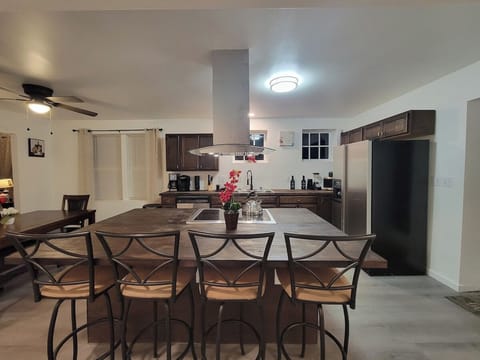 Center Island with fully equipped kitchen with air fryer microwave, coffee maker,  waffle maker and basic condiments.