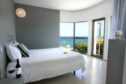 Junior Suite, Partial Sea View | In-room safe, blackout drapes, free WiFi, bed sheets