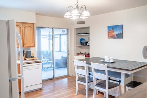 Fully appointed kitchen with seating at the dining table and bar