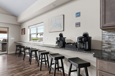 - Start your day with lake views & your favorite brew from the fully stocked coffee bar
- Breakfast counter is perfect for morning chats or quick bites before heading out
- Bright, welcoming, & designed for connection, it's your daily recharge spot
