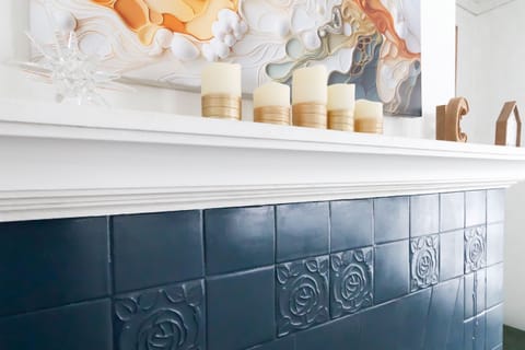 Love the mix of decorative items above the mantle, adds a personal touch.