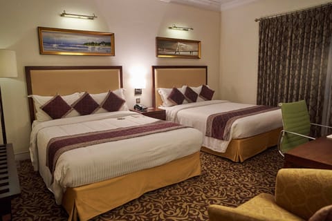 Queen Queen Room | Premium bedding, minibar, in-room safe, individually decorated