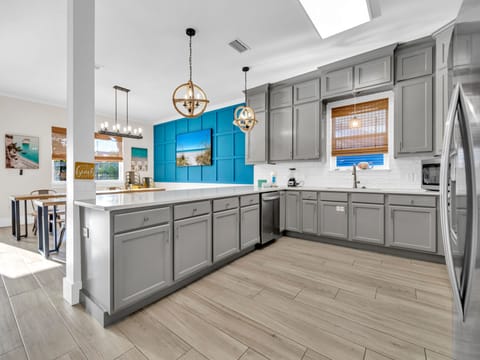 Sprawling Kitchen with Ample Counter Space & Stainless Steel Appliances
