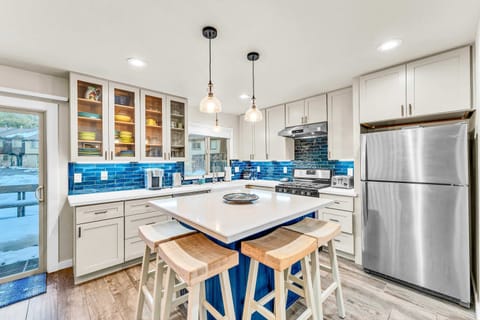 Kitchen: Keurig coffee maker, Crockpot, blender, cooking utensils, tableware